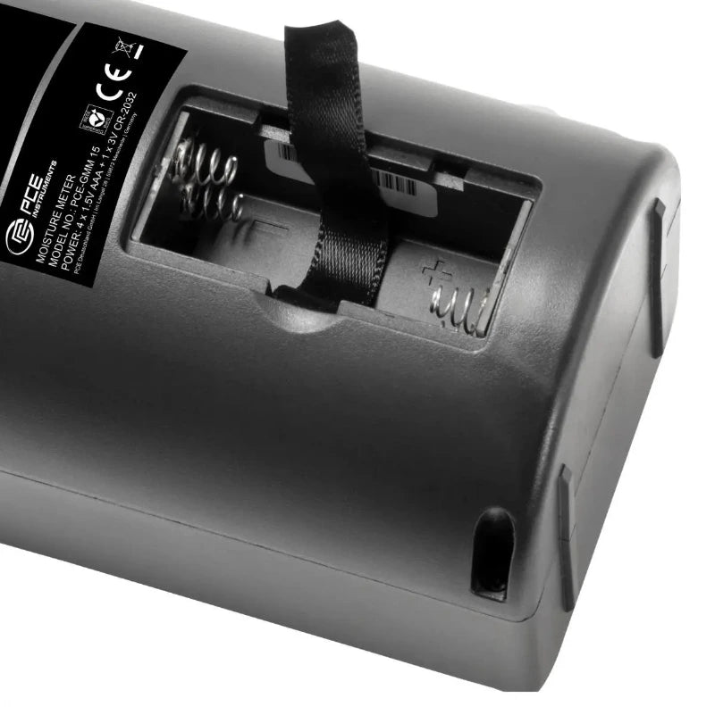 Close-up of a gray electronic device with a visible brand label on a white background