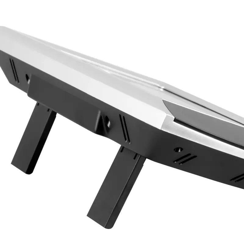 Close-up of a black stand with a reflective surface on a white background