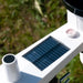 Close-up of a device with a solar panel on a natural background