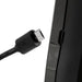 Black USB-C cable being plugged into a black electronic device on a white background
