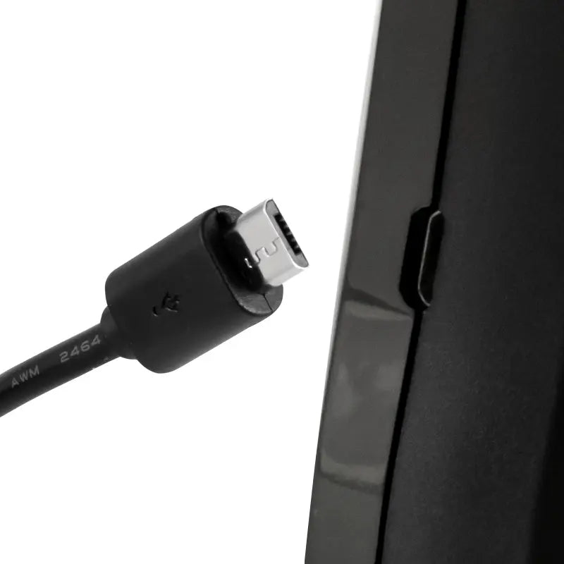 Black USB-C cable being plugged into a black electronic device on a white background