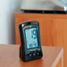 Air quality detector on a wooden surface with a blurred background