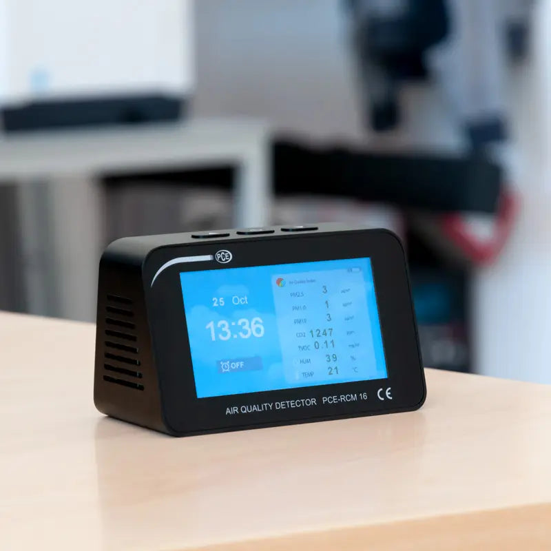 Air quality detector on a table with a blurred background