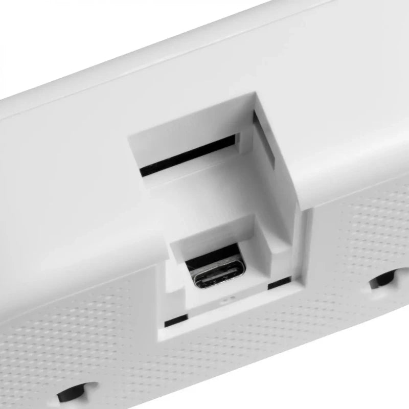Close-up of a white air quality meter with ports on a white background