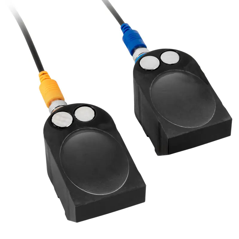 Two black electronic devices with cables on a white background