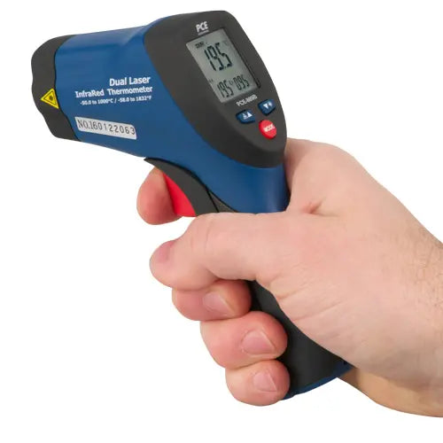 Digital thermometer held in a hand with a white background