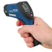 Digital thermometer held in a hand with a white background