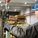 Person using a digital weight scale in a warehouse setting