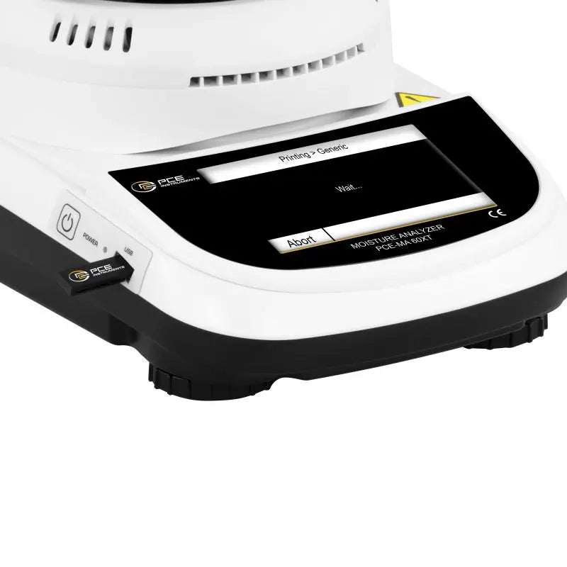 Close-up of a moisture analyzer with a display screen on a white background