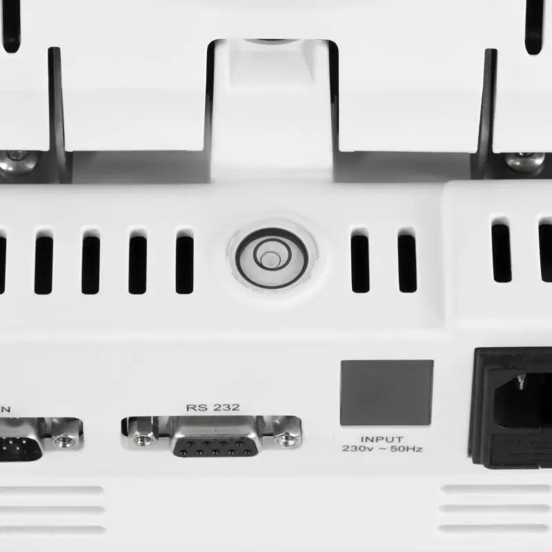 Close-up of a moisture analyzer with various ports and labels on a white background