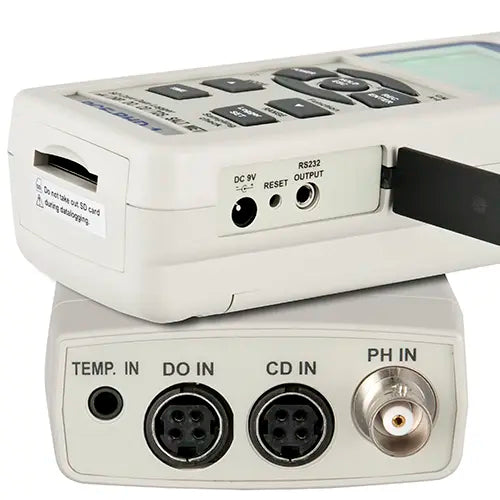 Close-up of a scientific measurement device with various input and output ports.