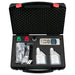 Open black tool case with various items including a digital device, bottles, and packaging on a white background.