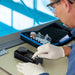 Person in a laboratory setting using scientific equipment