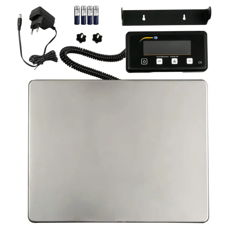 Digital scale with display, power adapter, batteries, and mounting bracket on a white background