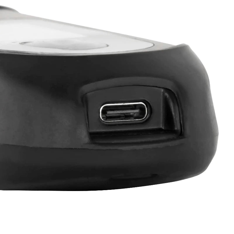Close-up of a black refractometer with a USB port on a white background