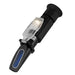 Handheld refractometer on a white background