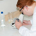 Person using a refractometer in a laboratory setting