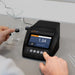 Turbidity Meter on a laboratory counter with a person interacting with it