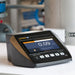 Turbidity Meter with a screen displaying a reading on a white surface.