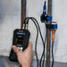 someone using an ultrasonic flow meter with sensors