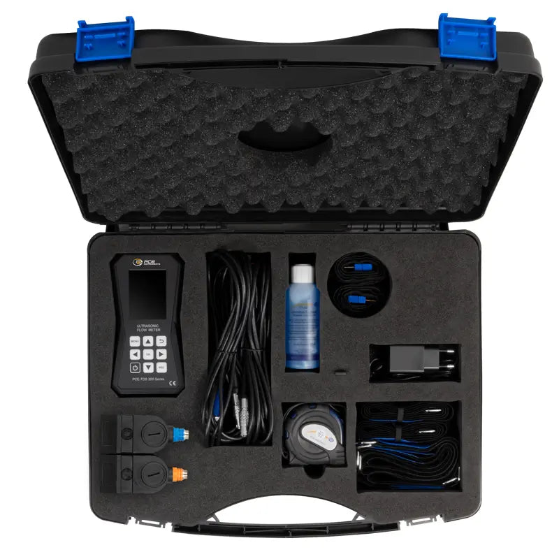 Carrying case holding an Ultrasonic Flow Meter with accessories