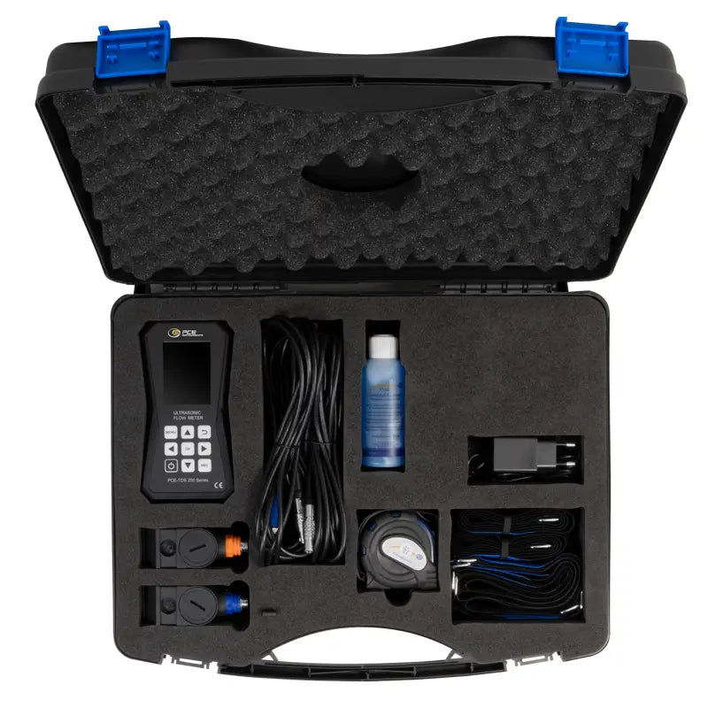 Black tool case with ultrasonic flow meter and accessories on a white background