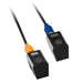 Two black sensor devices with colored cables on a white background