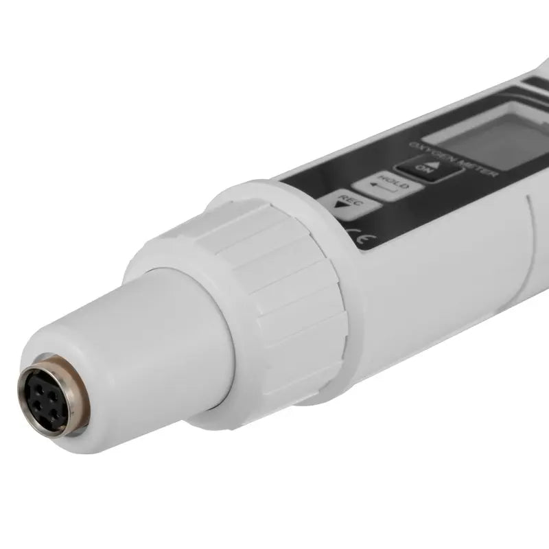 Digital water analysis meter with a white body and black display on a white background